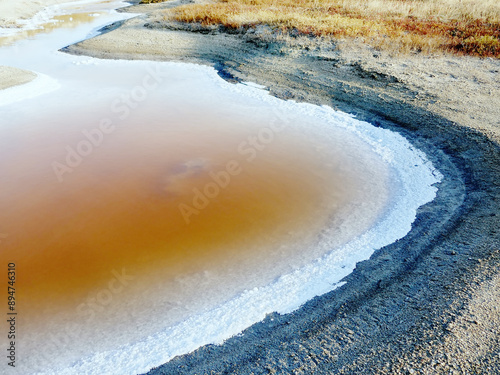 Bitter-salty internal-flow system through mud salty marches. Salt deposition in summer photo