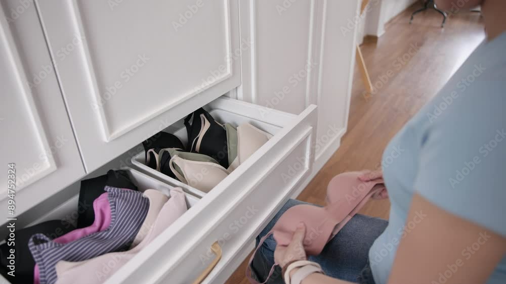 Young adult woman asia people arrange stack undies manage used old bra neat basket box clean house closet shelf eco care. Happy asian go green wife home chores zero waste reduce fabric issue Young adult woman asia people arrange stack undies manage used old bra neat basket box clean house closet shelf eco care. Happy asian go green wife home chores zero waste reduce fabric issue