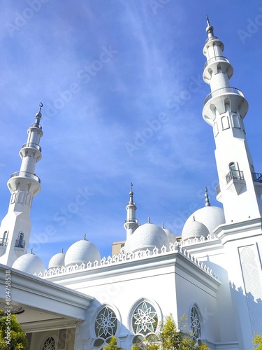 Beautiful mosque roof architecture with bright blue sky background photo