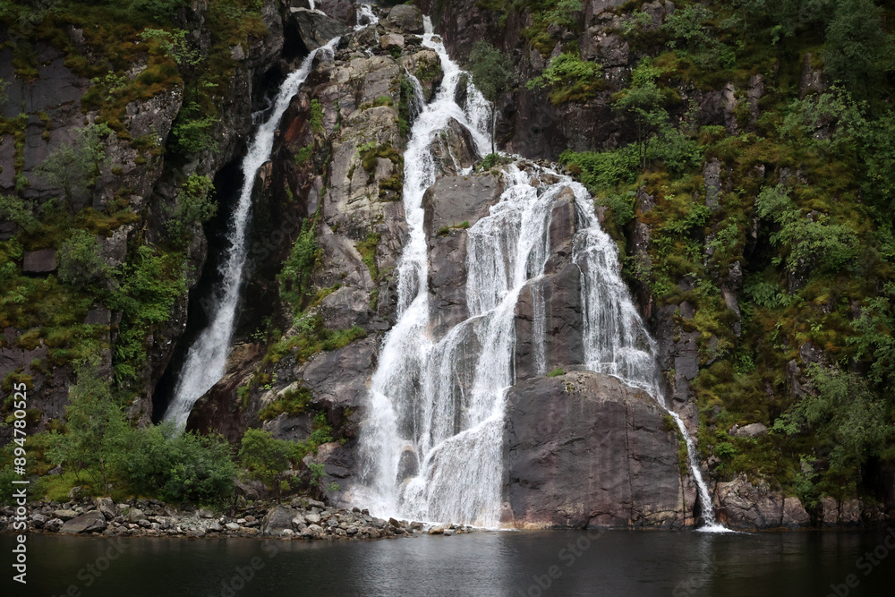Hengjanefossen waterfall in Lysefjord, Norway Hengjanefossen waterfall in Lysefjord, Norway