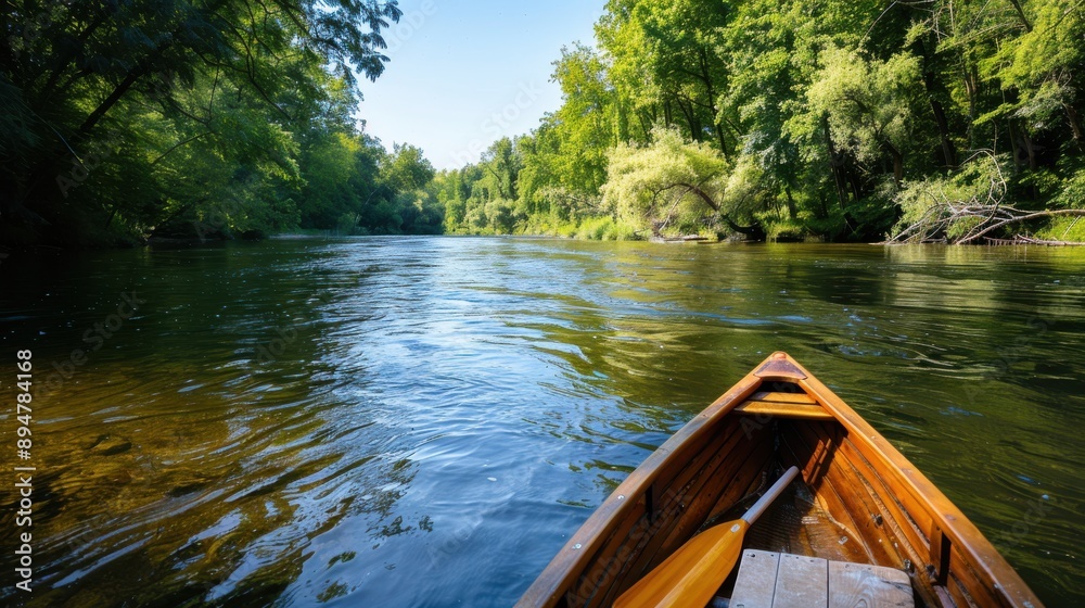 A wooden boat glides on a calm river, surrounded by dense green foliage, reflecting the serene ambiance of a peaceful outdoor adventure in nature with a clear sky above. A wooden boat glides on a calm river, surrounded by dense green foliage, reflecting the serene ambiance of a peaceful outdoor adventure in nature with a clear sky above.