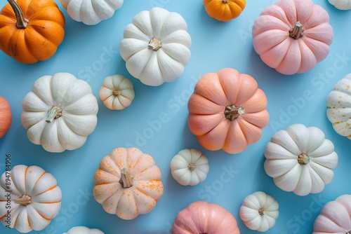 Small pumpkins in vibrant colors on pastel blue background. Generative Ai