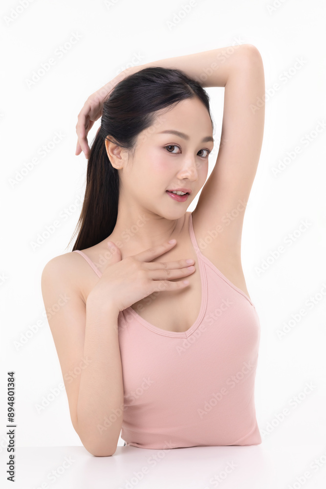 Beautiful young Asian woman lifting hand up to shows off clean and clear armpit or underarms isolated on white background, Smooth and freshness armpit concept. Beautiful young Asian woman lifting hand up to shows off clean and clear armpit or underarms isolated on white background, Smooth and freshness armpit concept.