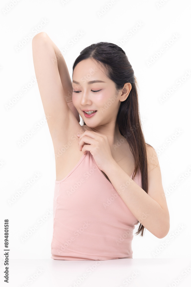 Beautiful young Asian woman lifting hand up to shows off clean and clear armpit or underarms isolated on white background, Smooth and freshness armpit concept. Beautiful young Asian woman lifting hand up to shows off clean and clear armpit or underarms isolated on white background, Smooth and freshness armpit concept.