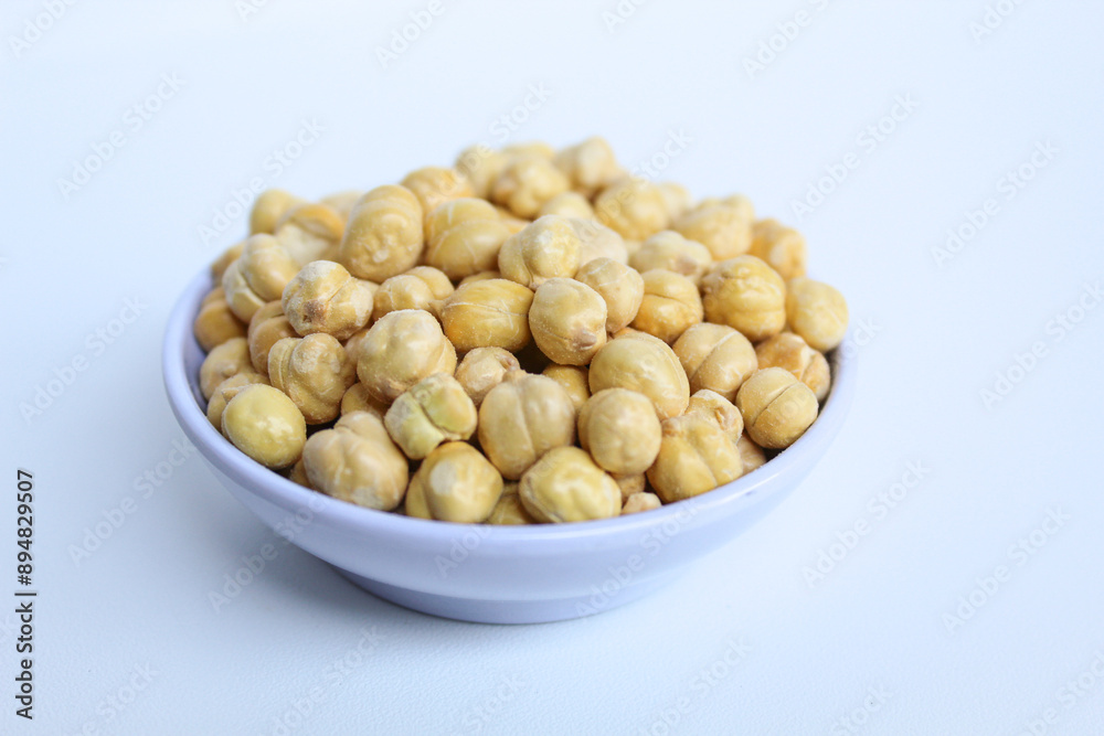 Chickpeas in small white bowl, isolated on white background Chickpeas in small white bowl, isolated on white background