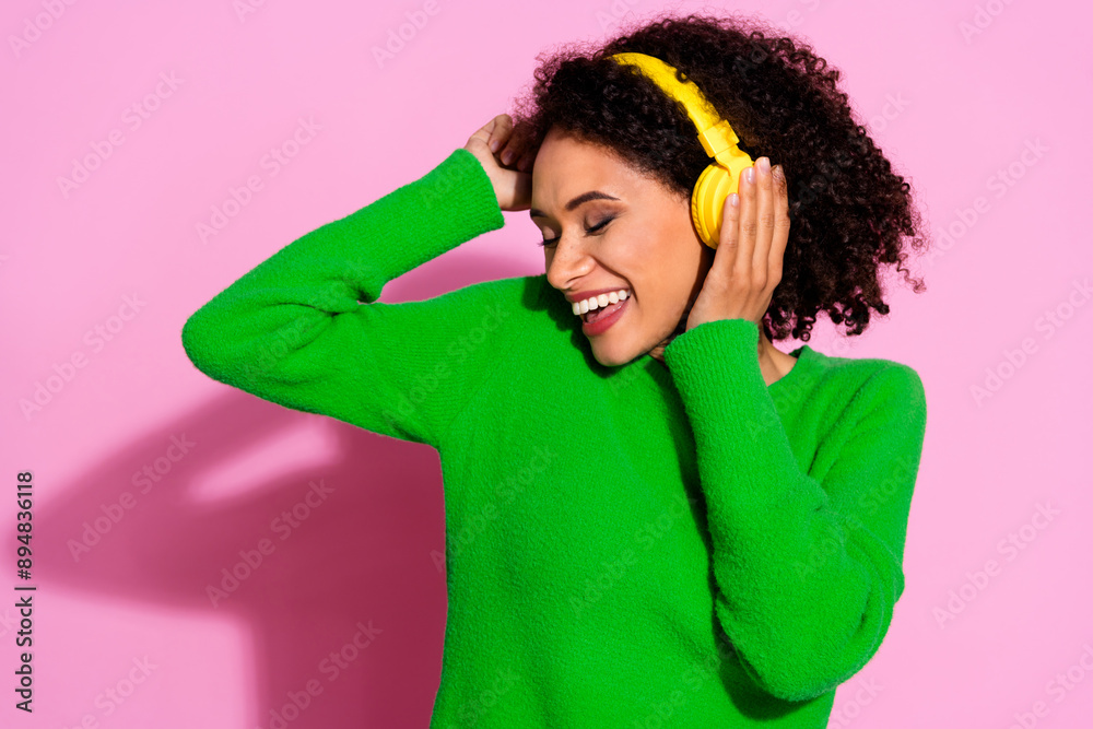 Photo portrait of lovely young lady headphones dancing dressed stylish green garment isolated on pink color background Photo portrait of lovely young lady headphones dancing dressed stylish green garment isolated on pink color background