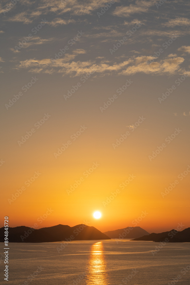 Orange sunset sun over the islands in the Mediterranean Sea Orange sunset sun over the islands in the Mediterranean Sea