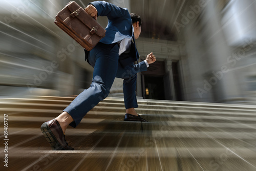 Businessman with briefcase stepping up the stairs quickly for get fund and loan, Busy man is in a hurry, time is money, Business