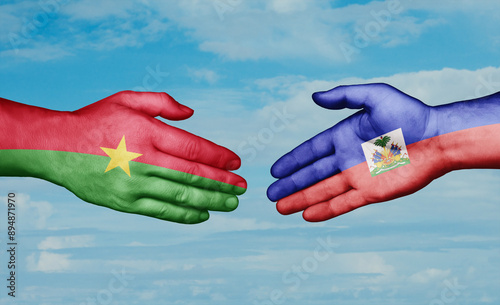 Obraz na płótnie Haiti and Burkina Faso country handshaking with flags, consensus concept international co-operation illustration w salonie
