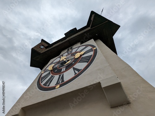 The iconic Grazer Uhrturm clock tower located on Schlossberg hill, symbol of Graz, Austria.

