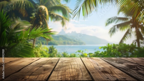 A wooden table with a blurred background of a tropical beach with palm trees, ocean, and mountains in the distance. © Prostock-studio