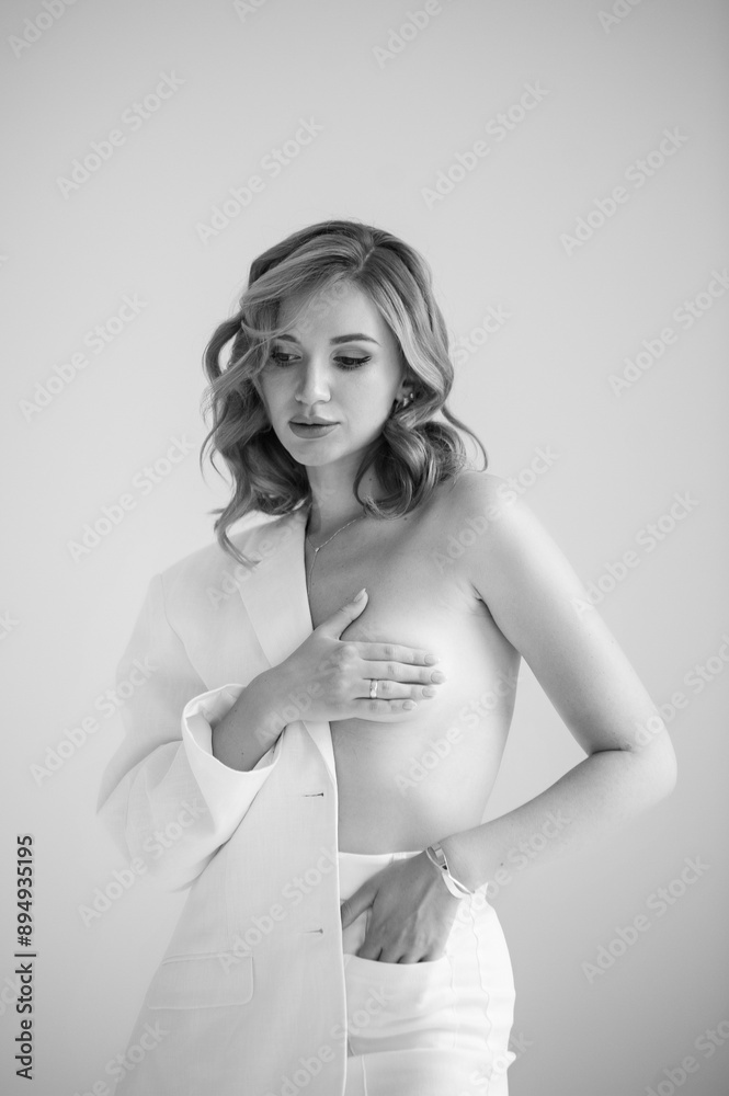 Elegant woman in white suit on white background Elegant woman in white suit on white background