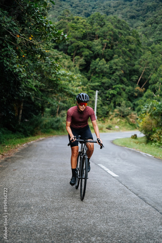 a young woman riding her gravel bike in the mountains.