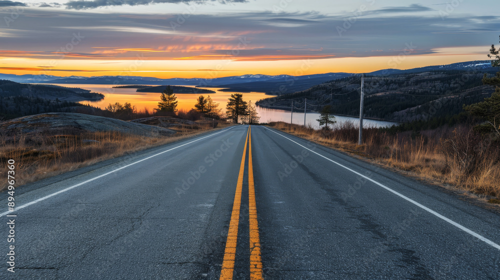 Open Road to Sunset: A scenic highway winds through a picturesque landscape, leading towards a breathtaking sunset over a vast lake with a mountain range in the distance, evoking a sense of adventure Open Road to Sunset: A scenic highway winds through a picturesque landscape, leading towards a breathtaking sunset over a vast lake with a mountain range in the distance, evoking a sense of adventure