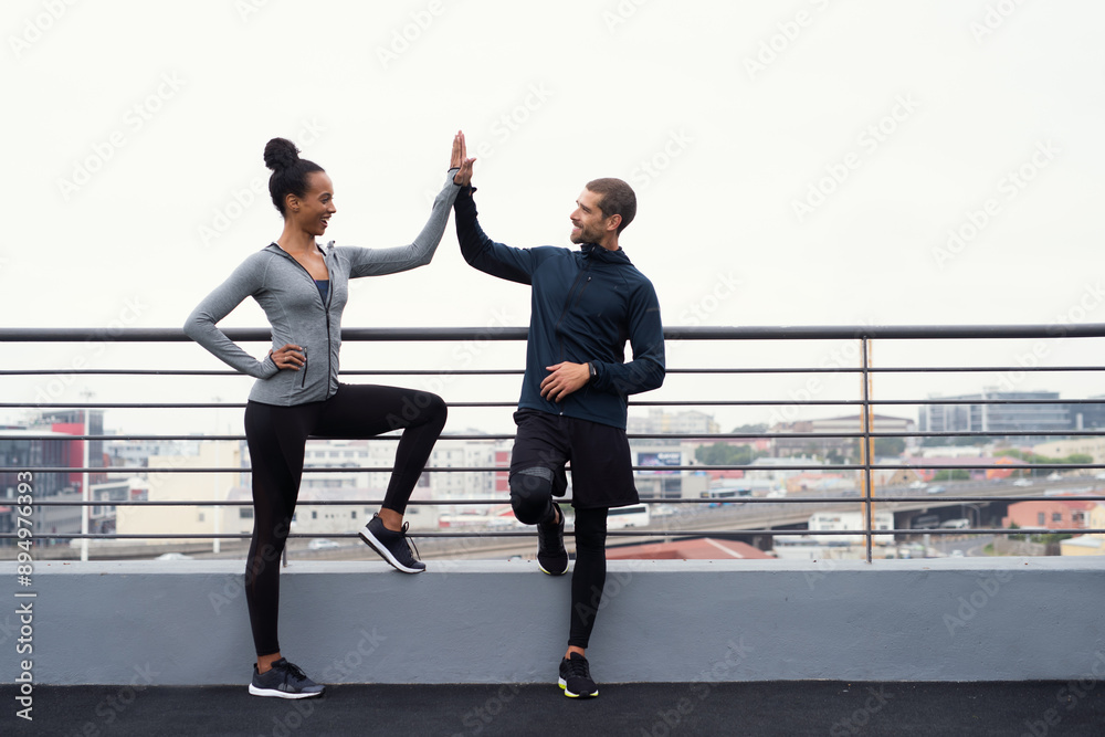 Teamwork, high five and fitness with exercise, outdoor and break with motivation, support or smile for goals. Man, woman and workout together for success, muscle or happy for personal trainer in city Teamwork, high five and fitness with exercise, outdoor and break with motivation, support or smile for goals. Man, woman and workout together for success, muscle or happy for personal trainer in city