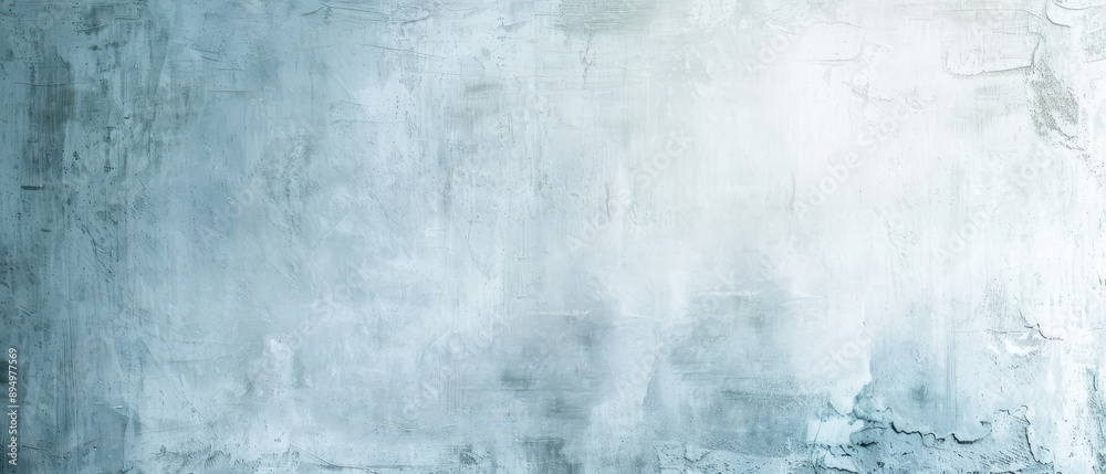 Fototapeta premium A wall with a blue and white background. The wall is made of concrete and has a rough texture