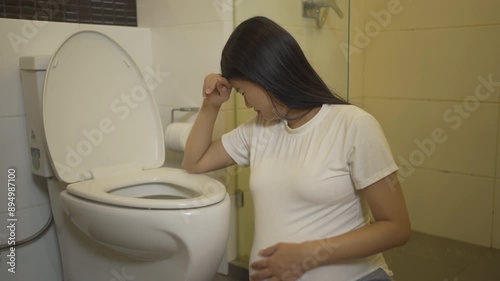 A portrait of happy Asian pregnant woman in toilet,  bathroom or restroom. Having a baby. Family people lifestyle. Mom love.