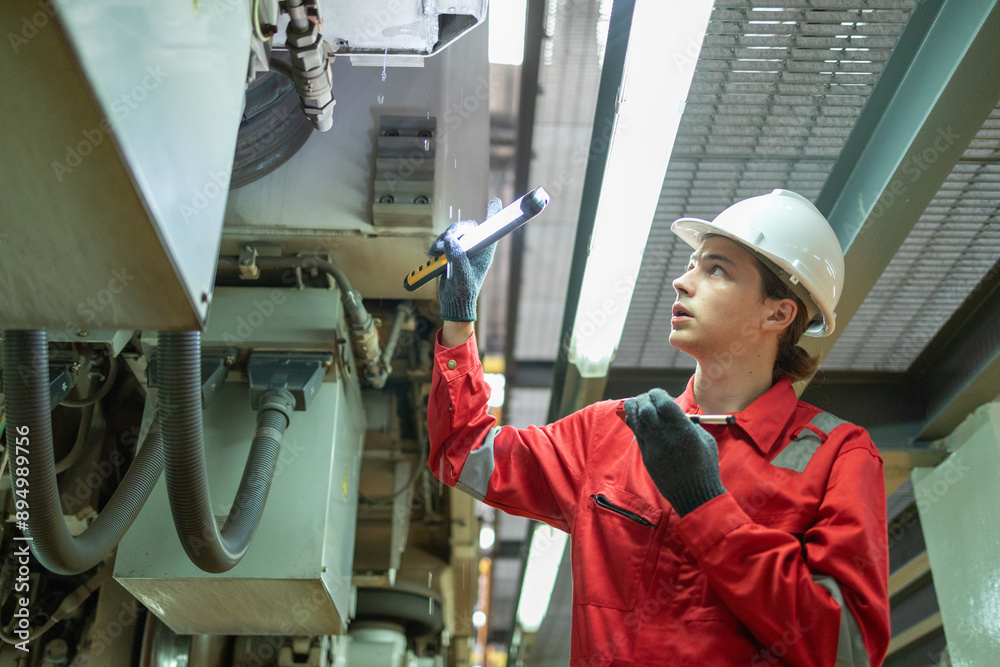 Technician Inspecting Train Suspension System Technician Inspecting Train Suspension System