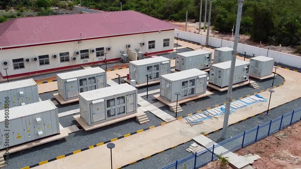 Aerial view of battery energy storage system BESS array at renewable solar power farm in The Gambia, West Africa Aerial view of battery energy storage system BESS array at renewable solar power farm in The Gambia, West Africa