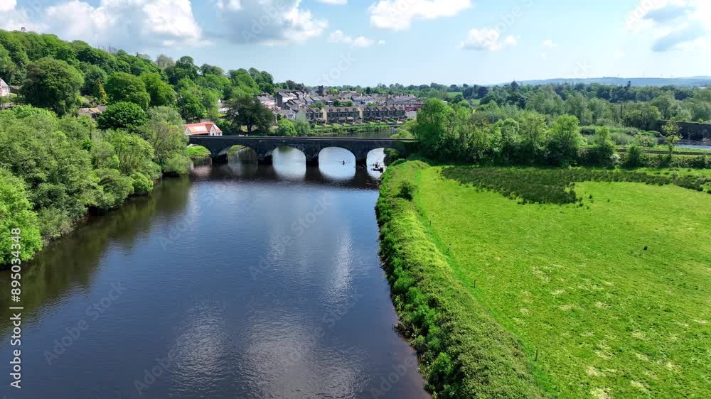 Ireland Epic Locations drone flying over Cappoquin bridge with rowing boat passing under the bridge Waterford Ireland Ireland Epic Locations drone flying over Cappoquin bridge with rowing boat passing under the bridge Waterford Ireland