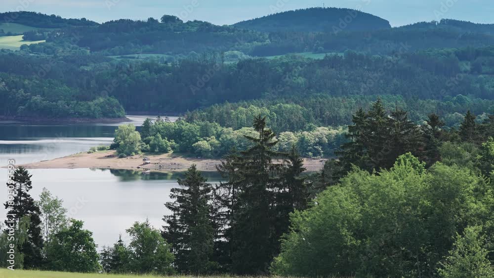 A peaceful river e with green hills and trees in the background, creating a picturesque and calm atmosphere A peaceful river e with green hills and trees in the background, creating a picturesque and calm atmosphere