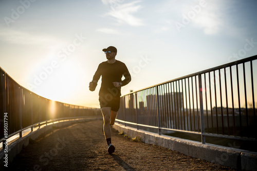 Mid 20s male trail running. photo