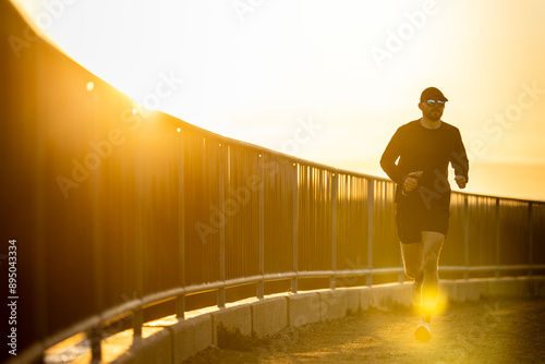 Mid 20s male trail running. photo