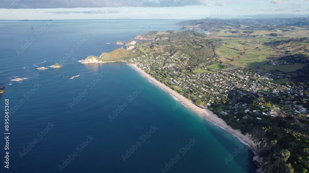 Coastal Town And Accommodation Resort Of Hahei And Cathedral Cove On Coromandel Peninsula, North Island, New Zealand. Aerial Shot Coastal Town And Accommodation Resort Of Hahei And Cathedral Cove On Coromandel Peninsula, North Island, New Zealand. Aerial Shot