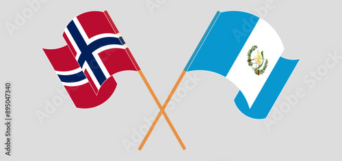 Crossed and waving flags of Norway and Republic of Guatemala