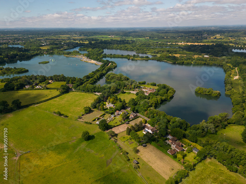 Obraz na płótnie Panoramic view of Blashford Lakes Nature Reserve in New Forest UK. Recreational sailing on the lake near Ringwood. Beautiful English countryside and peaceful environment. w salonie