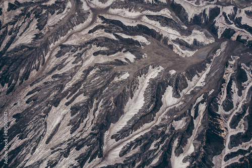 Grey and white rock formations on a rugged mountainside in Bromo Tengger Semeru National Park in Indonesia; Ranupani, East Java, Indonesia photo