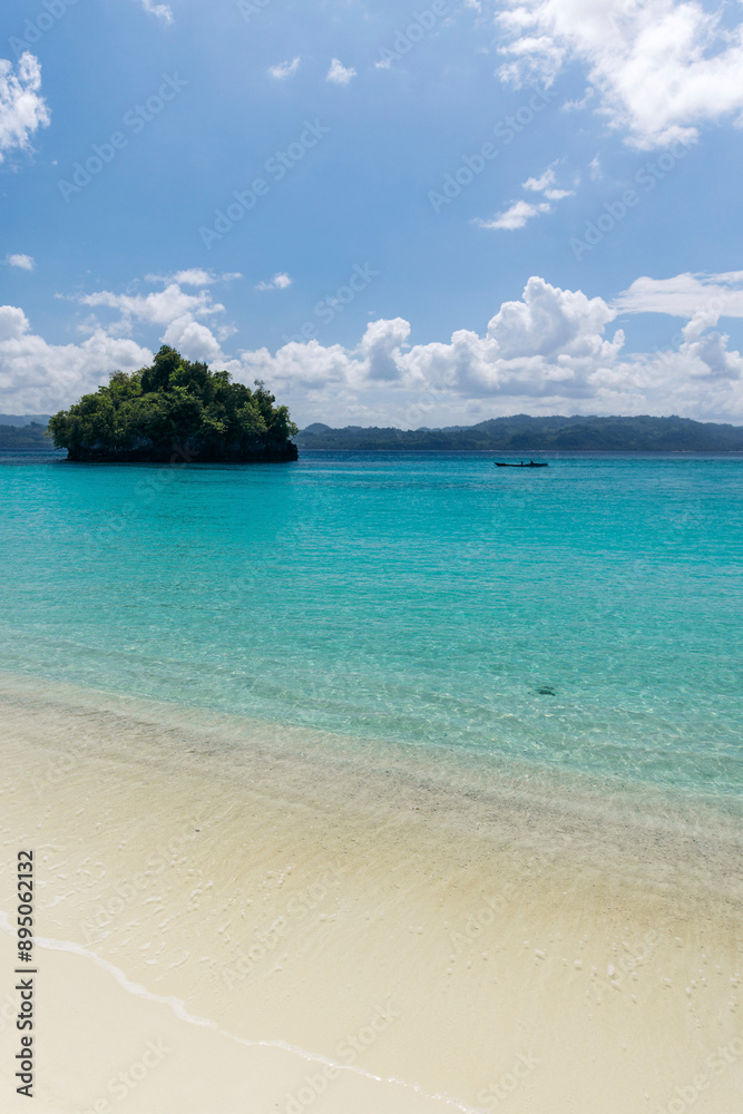 Exotic white sand and clear turquoise water of Pantai Oyama in Sulawesi Tengah, Indonesia; Popisi, Banggai Utara, Kabupaten Banggai Laut, Sulawesi Tengah, Indonesia Exotic white sand and clear turquoise water of Pantai Oyama in Sulawesi Tengah, Indonesia; Popisi, Banggai Utara, Kabupaten Banggai Laut, Sulawesi Tengah, Indonesia