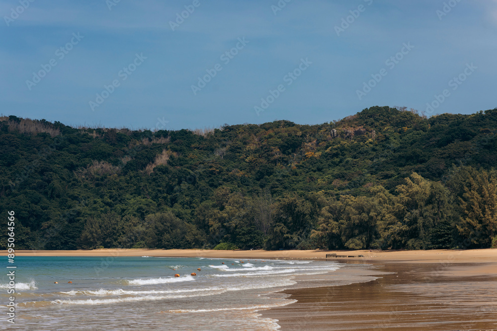Beautiful Dam Trau Beach with buoys lining a swimming area, in the Con Dao archipelago, South China Sea, Vietnam; Con Dao, Ba Ria - Vung Tau, Vietnam Beautiful Dam Trau Beach with buoys lining a swimming area, in the Con Dao archipelago, South China Sea, Vietnam; Con Dao, Ba Ria - Vung Tau, Vietnam