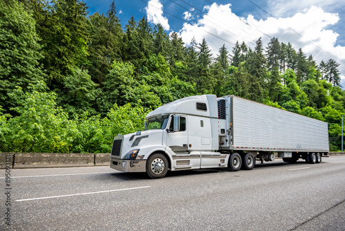 Konstfotografi Popular comfortable big rig semi truck tractor transporting cargo in refrigerate