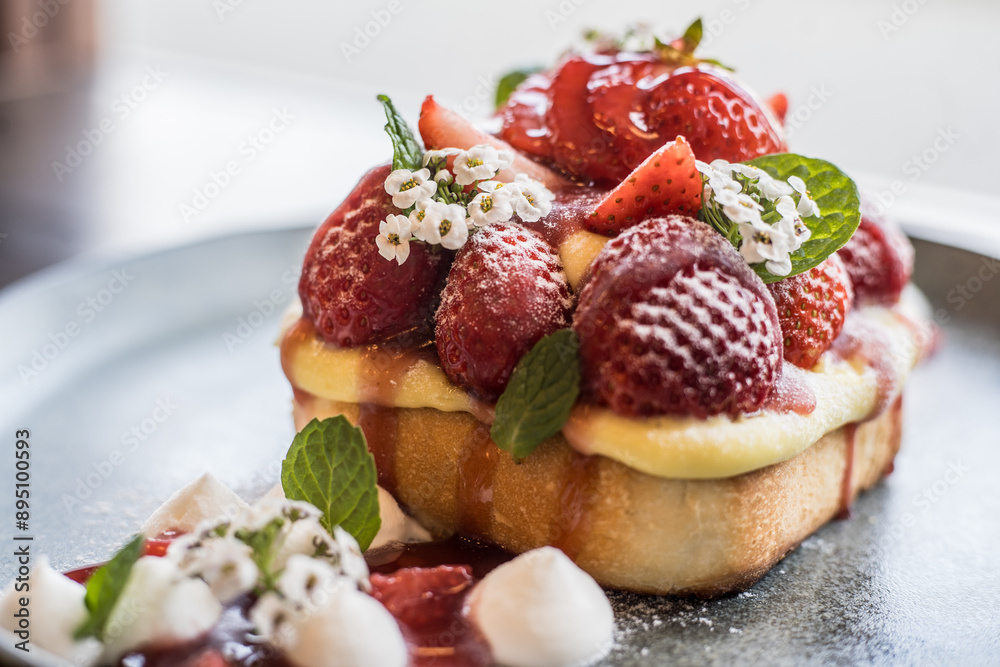 A french toast decorated with fresh strawberries A french toast decorated with fresh strawberries