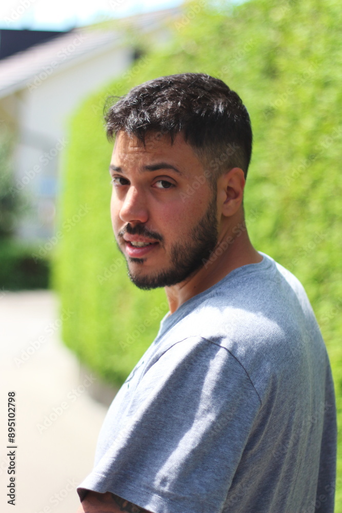 Young Tattooed Man in Sporting Clothes in the City of Zurich on a Sunny Day Young Tattooed Man in Sporting Clothes in the City of Zurich on a Sunny Day