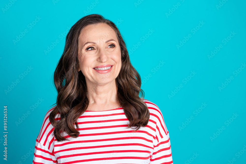 Photo of nice aged woman look empty space wear pullover isolated on teal color background Photo of nice aged woman look empty space wear pullover isolated on teal color background