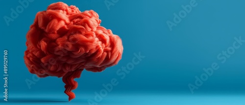  A red brain-shaped substance up-close against a blue backdrop Include text space