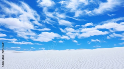 Beautiful white sand dunes on a background of the blue sky © Voilla