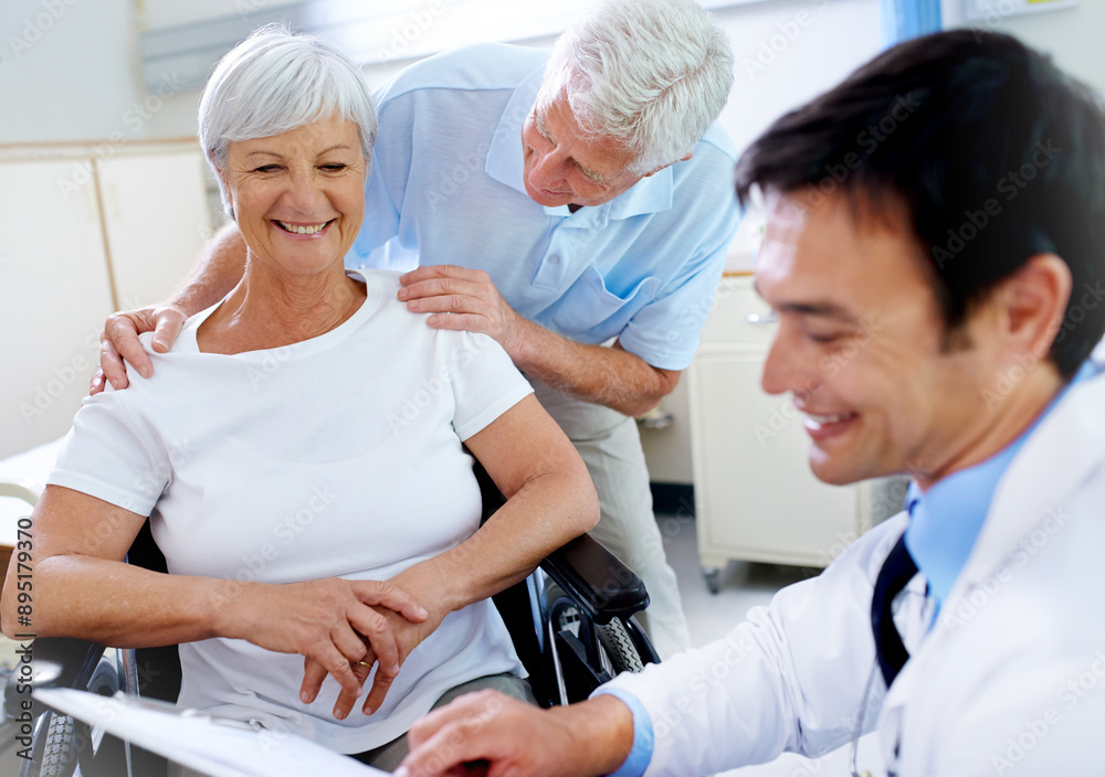 Fototapeta premium Doctor, reading and senior patient in wheelchair with a disability, happy and appointment with husband for support. Elderly woman, medical worker and checklist for test results and progress notes.