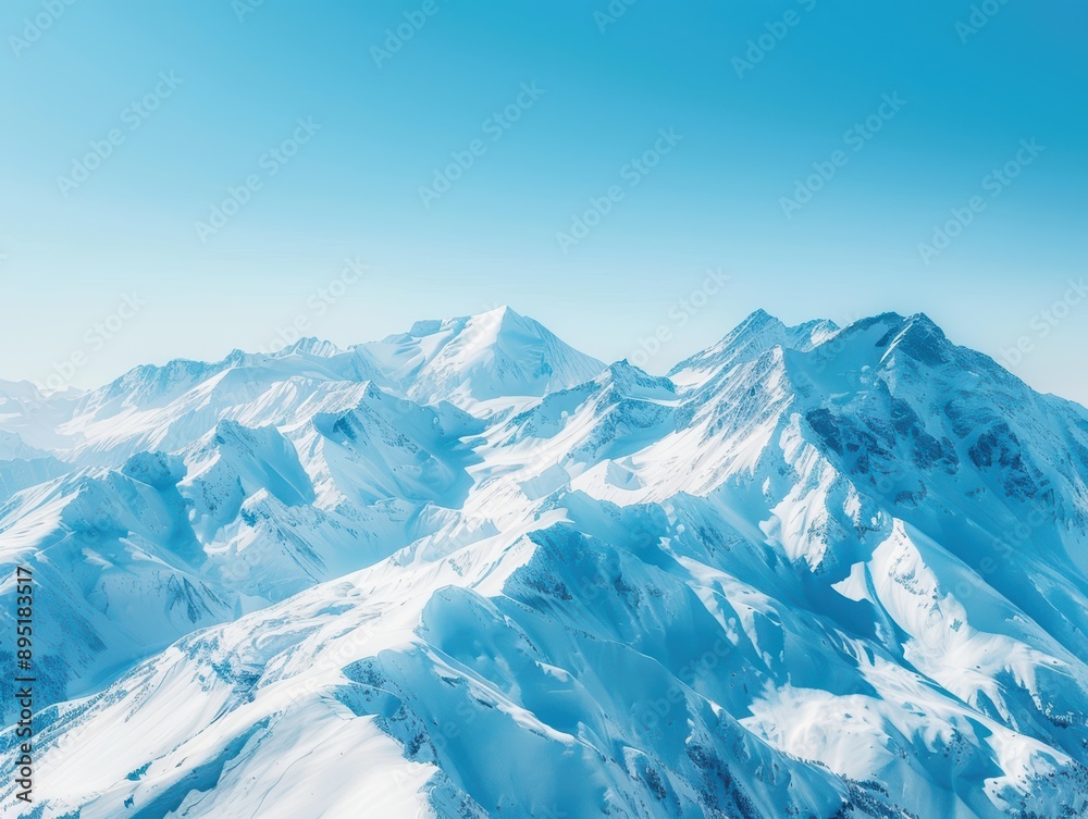 Fototapeta premium Snow-capped mountains under a clear blue sky, pristine and majestic.