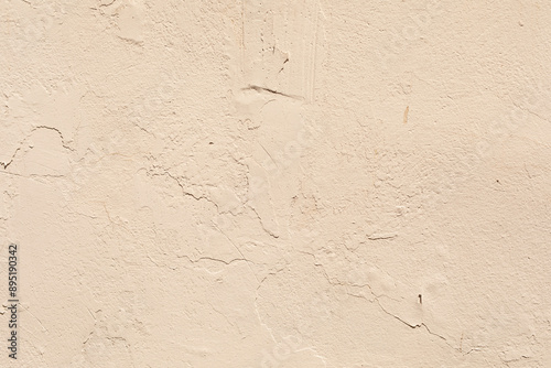 A textured beige wall with ...