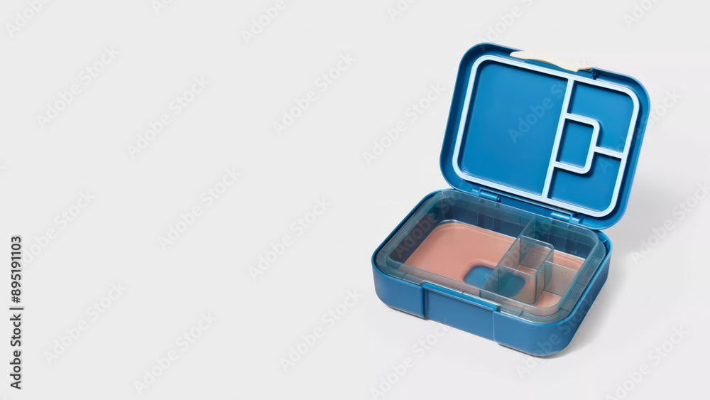 Closeup of small bento lunchbox isolated on copy-space background. Closeup of small bento lunchbox isolated on copy-space background.