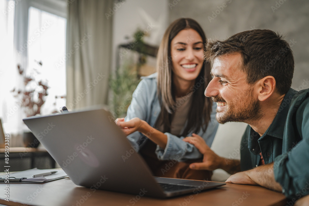 Boyfriend work from home on laptop, while girlfriend use mobile phone Boyfriend work from home on laptop, while girlfriend use mobile phone