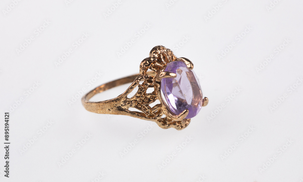 gold ring with amethyst isolated on white background gold ring with amethyst isolated on white background