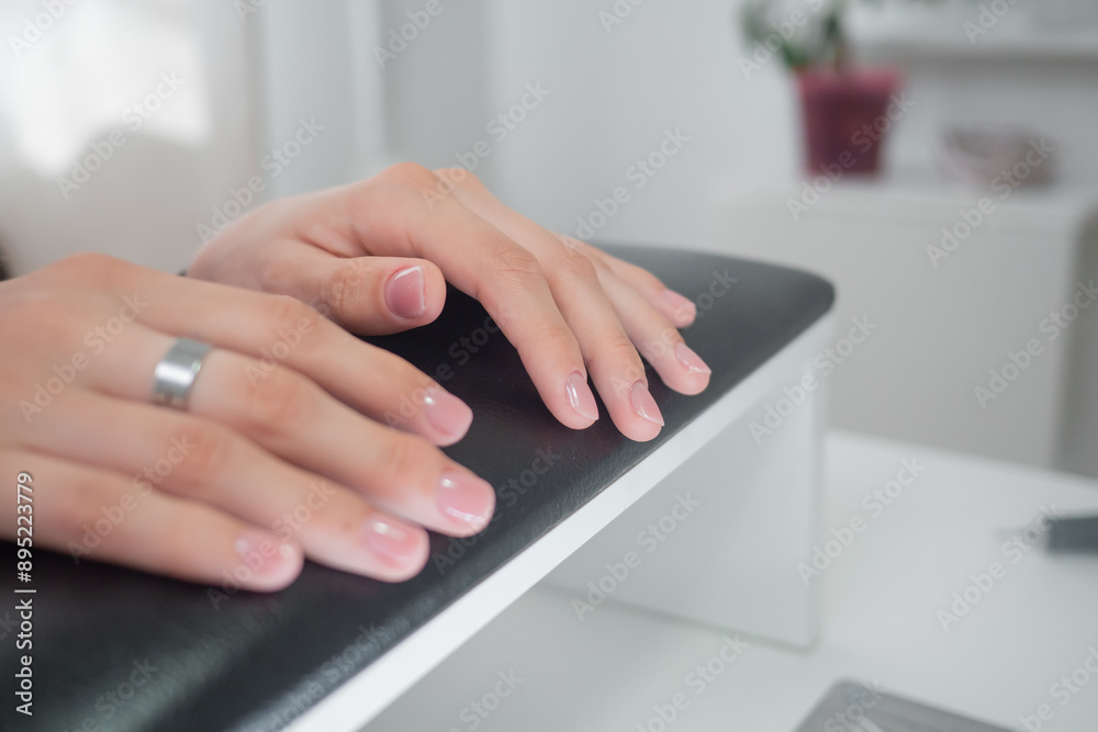 Female hands with beautiful natural elegant manicure. Manicure in a luxury beauty SPA salon. Concept nails and hands care Female hands with beautiful natural elegant manicure. Manicure in a luxury beauty SPA salon. Concept nails and hands care