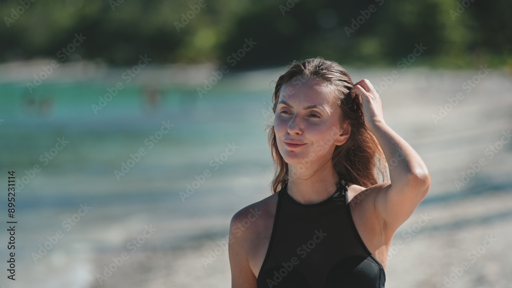 Beautiful young woman walk tropical beach. Caucasian girl in bikini enjoy nature landscape with blue sea and white sand shore. Relax on tropical island, nature summer scene. Travel, tourism, holiday