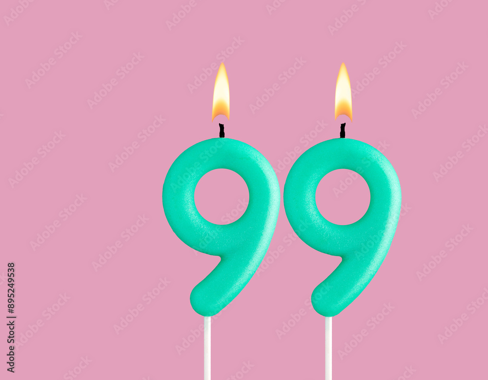 Green candle number 99 - Birthday card on pastel pink background Green candle number 99 - Birthday card on pastel pink background