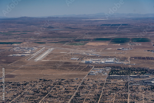 Palmdale, CA, USA, aerial landscape view of area around Palmdale Regional Airport located in Antelope Valley at west tip of Mojave Desert with many famous aviation companies at the airport photo