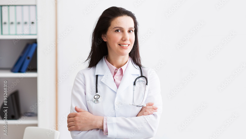 Portrait Of Successful Doctor Posing On Light Background, Copy Space Portrait Of Successful Doctor Posing On Light Background, Copy Space